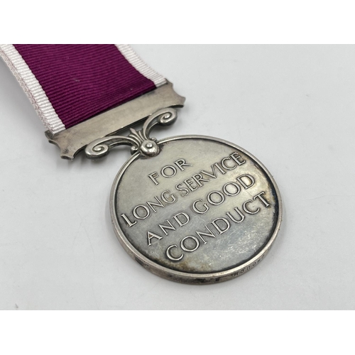 2315 - A George V Regular Army Long Service and Good Conduct Service medal presented to 1031810 Sjt. A. J. ... 