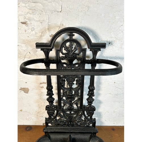 632 - A Coalbrookdale style black cast metal stick stand - approx. 50cm high