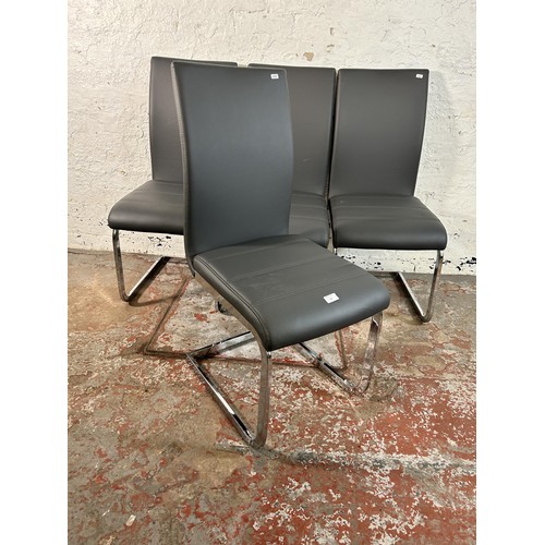 112 - Four modern grey faux leather and chrome plated cantilever dining chairs