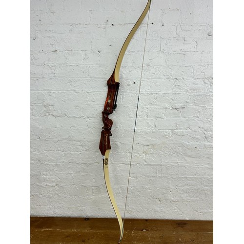 769 - A Marksman Archery Products Sherwood Forest Bowcraft longbow, marked Olympic.T.S.4. 66. 6682. 42 ½ a... 