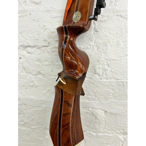 769 - A Marksman Archery Products Sherwood Forest Bowcraft longbow, marked Olympic.T.S.4. 66. 6682. 42 ½ a... 