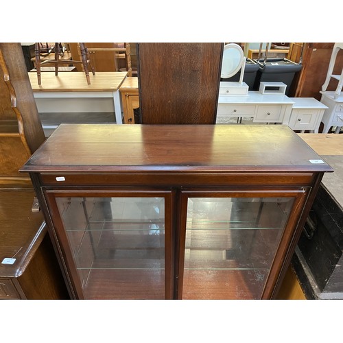 168 - A mahogany display cabinet on cabriole supports