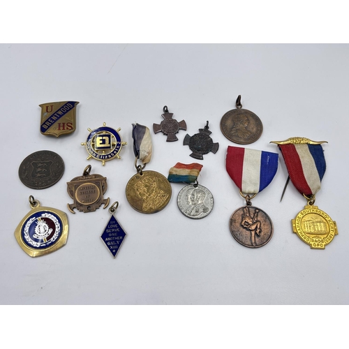 2120 - A collection of medals and badges to include King George VI and Queen Elizabeth 1937 Coronation meda... 