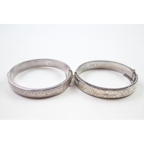 2330A - Two silver floral design bangles - approx. gross weight 39g