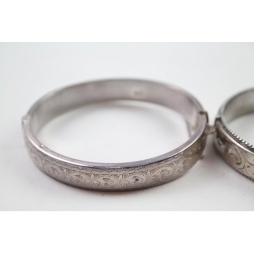 2330A - Two silver floral design bangles - approx. gross weight 39g