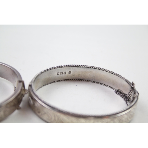 2330A - Two silver floral design bangles - approx. gross weight 39g