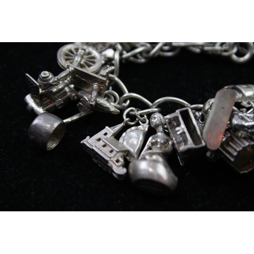 2336 - A silver charm bracelet with novelty charms - approx. gross weight 116g