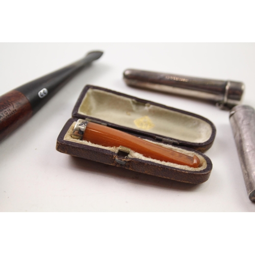 2377 - Five pieces of tobacciana, three .925 silver cheroot cases, one Chacom pipe and one cased amber and ... 