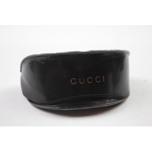 617 - A cased pair of Gucci sunglasses