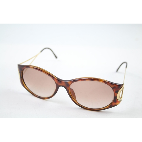 619 - A pair of cased Christian Dior sunglasses