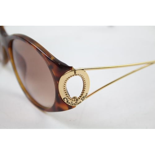 619 - A pair of cased Christian Dior sunglasses