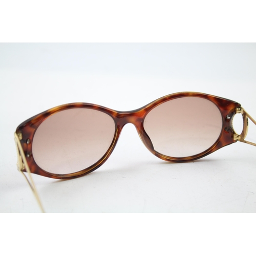 619 - A pair of cased Christian Dior sunglasses