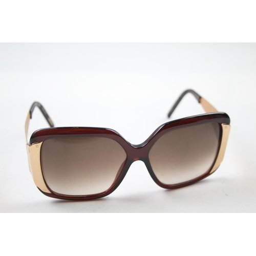 620 - A cased pair of Chopard sunglasses