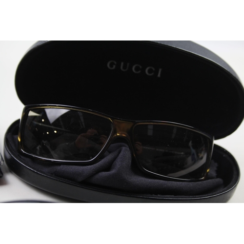 628 - Three pairs of sunglasses to include Gucci etc.