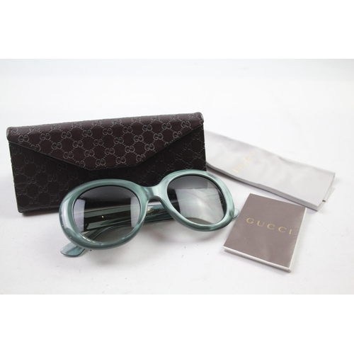 629 - A cased pair of Gucci sunglasses