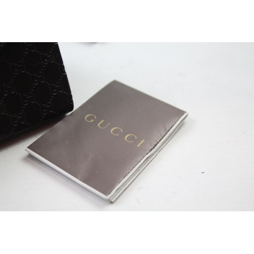 629 - A cased pair of Gucci sunglasses