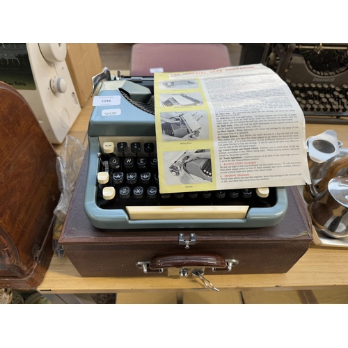 985 - A cased Imperial Typewriter Co. Ltd. model 6 Desk Companion portable typewriter with instruction man... 