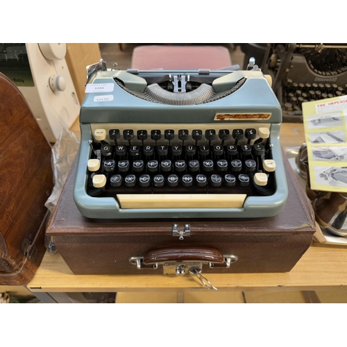 985 - A cased Imperial Typewriter Co. Ltd. model 6 Desk Companion portable typewriter with instruction man... 