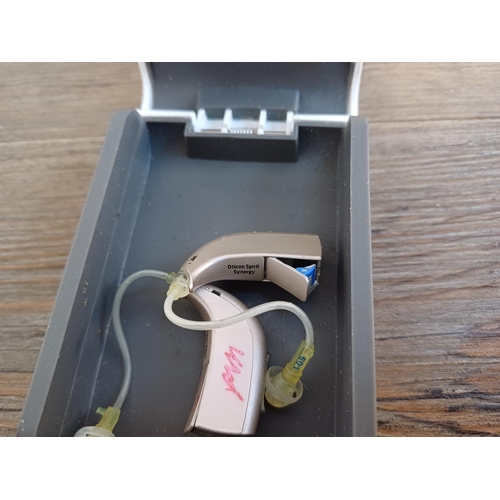 845 - A cased pair of Oticon Spirit Synergy hearing aids