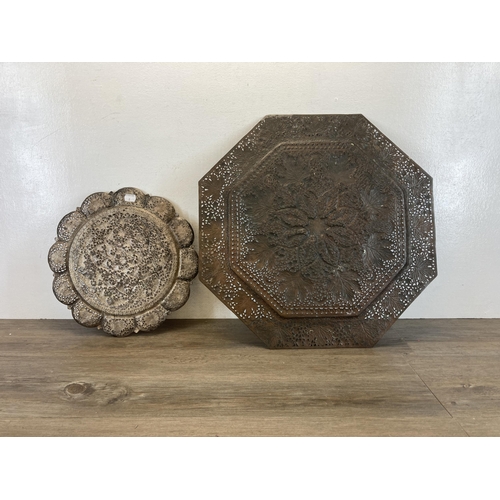 529 - Two Middle Eastern pierced and engraved copper wall chargers - largest approx. 51cm high