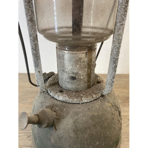 535 - Two mid 20th century red enamel and metal paraffin lanterns