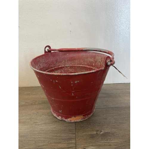 537 - Two items, one vintage galvanized red painted fire bucket and one green metal ammunition box