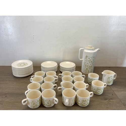 556 - A collection of 1970s Hornsea Fleur pottery to include eighteen coffee cups, coffee pot etc.