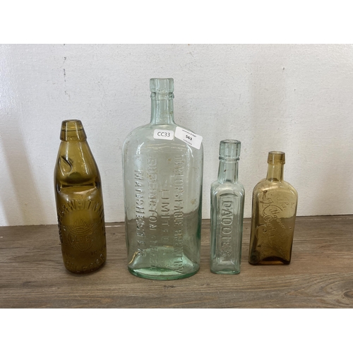 563 - A collection of vintage glass and stoneware bottles to include Parkinson Macclesfield, Thompson Mitc... 