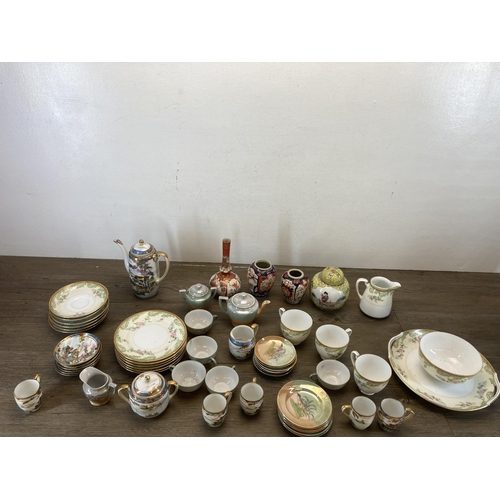 565 - A collection of Oriental ceramics to include Noritake, two Imari vases, Kutani bottleneck vase etc.