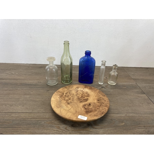 566 - A collection of vintage stoneware and glass bottles and jars together with an AB Dab Design burr oak... 