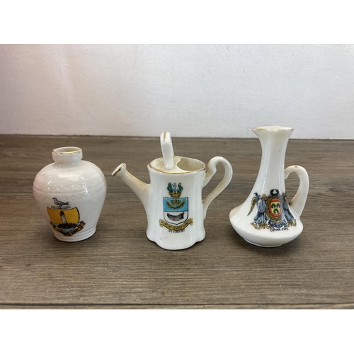 568 - A collection of crested china to include Macintyre Burslem Arms of Colwyn Bay jug with hallmarked st... 