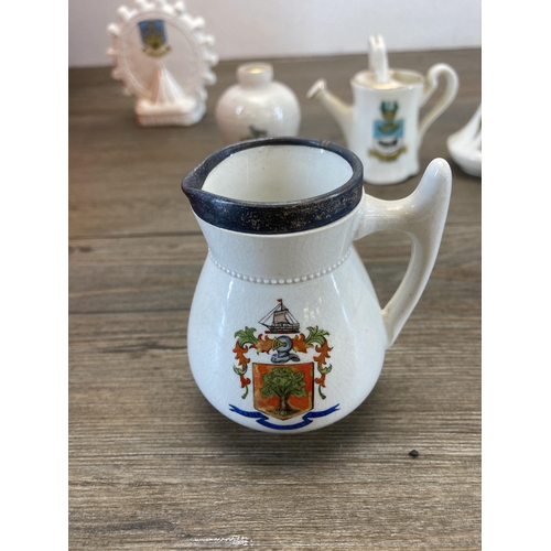 568 - A collection of crested china to include Macintyre Burslem Arms of Colwyn Bay jug with hallmarked st... 