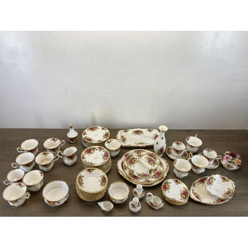 570 - A collection of Royal Albert Old Country Roses bone china to include thirteen cups, milk jug, sugar ... 