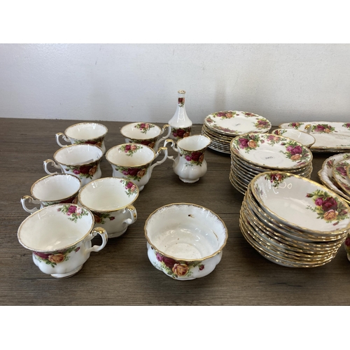 570 - A collection of Royal Albert Old Country Roses bone china to include thirteen cups, milk jug, sugar ... 