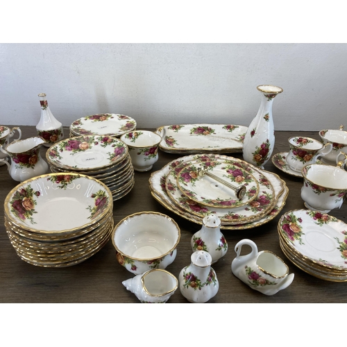 570 - A collection of Royal Albert Old Country Roses bone china to include thirteen cups, milk jug, sugar ... 