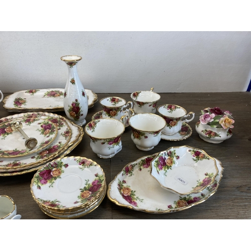 570 - A collection of Royal Albert Old Country Roses bone china to include thirteen cups, milk jug, sugar ... 