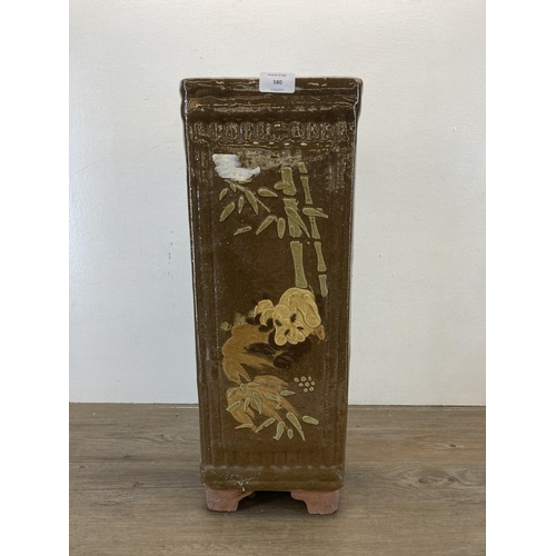 580 - An Oriental glazed terracotta planter/stick stand - approx. 53cm high