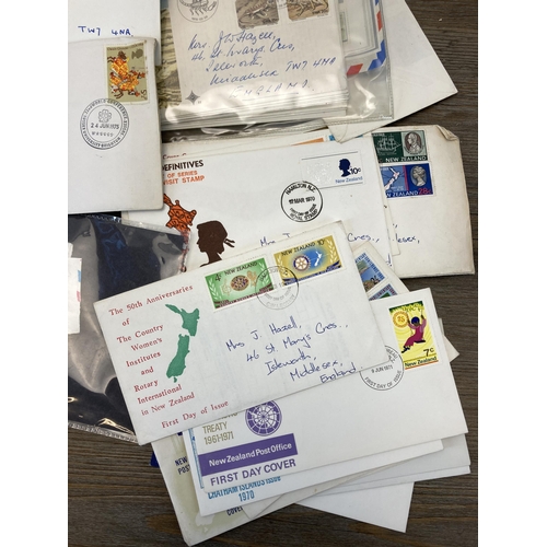 702 - A collection of first day covers and stamps