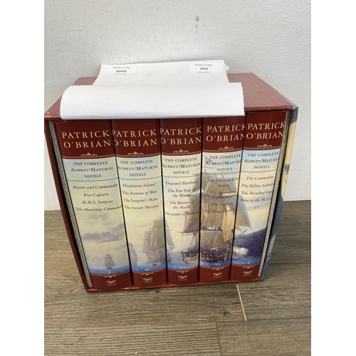 703 - Four items, one five hardback book boxset The Complete Aubrey/Maturin Novels by Patrick O'Brian, one... 