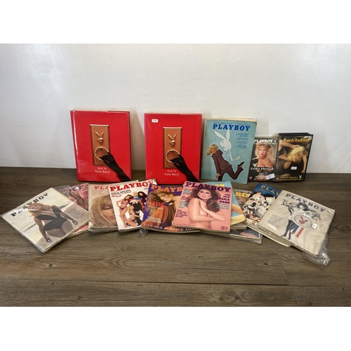 705 - A collection of vintage Playboy adult magazines, videos and hardback books