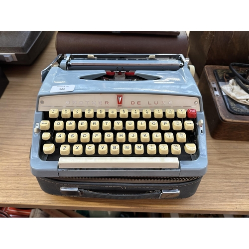 986 - A case Brother De luxe portable typewriter