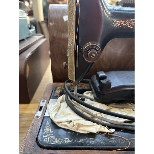 987 - A cased 1926 Singer 66K electric sewing machine with foot pedal and accessories