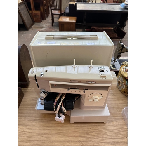 988 - A cased Singer 533 electric sewing machine with foot pedal