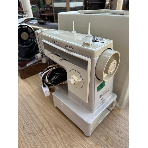 988 - A cased Singer 533 electric sewing machine with foot pedal