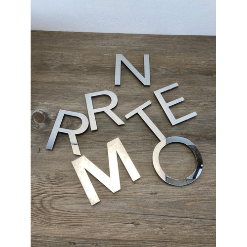 793 - A large collection of aluminium shop letters - largest approx. 12cm high x 13.5cm wide