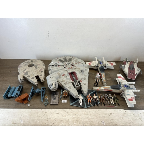 482 - A collection of Star Wars action figures and model spacecraft to include 1995 Lewis Galoob Toys Mill... 