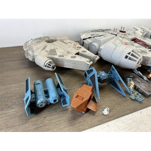 482 - A collection of Star Wars action figures and model spacecraft to include 1995 Lewis Galoob Toys Mill... 