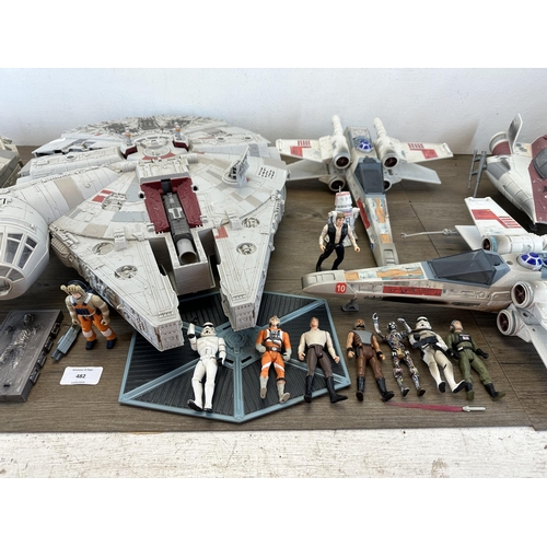 482 - A collection of Star Wars action figures and model spacecraft to include 1995 Lewis Galoob Toys Mill... 