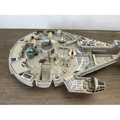 482 - A collection of Star Wars action figures and model spacecraft to include 1995 Lewis Galoob Toys Mill... 