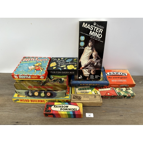 486 - A collection of mid 20th century boxed games to include Spear's Games DeLuxe Ludo and Snake & Ladder... 